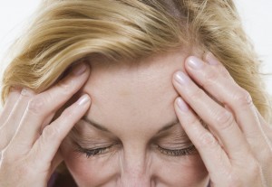 Woman with Headache --- Image by © Royalty-Free/Corbis